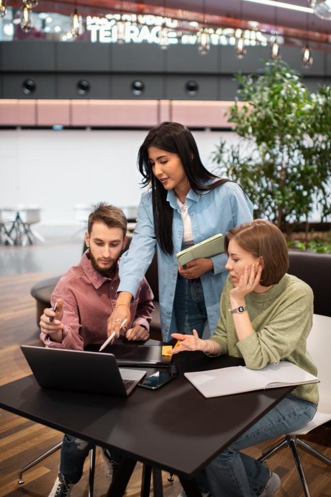 Employees collaborating in office